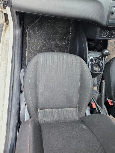 SEAT Ibiza Passenger Side Before Interior Recovery SEAT Ibiza passenger footwell before carpet extraction, deep cleaning and pet hair removal